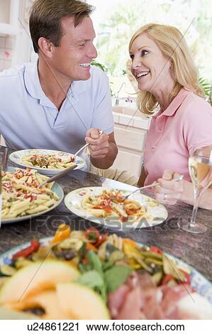 Couple Enjoying meal, mealtime Together View Large Photo Image Stock Image - Couple Enjoying meal, mealtime Together. Fotosearch
