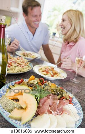 Stock Photography - Couple Enjoying meal, mealtime Together. Fotosearch