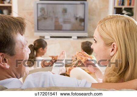 Couple Enjoying Pizza In Front Of TV View Large Photo Image Stock Image - Couple Enjoying Pizza In Front Of TV. Fotosearch