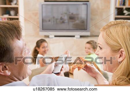 Couple Enjoying Pizza In Front Of TV View Large Photo Image Stock Photography - Couple Enjoying Pizza In Front Of TV. Fotosearch