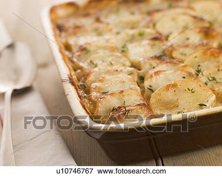 Dish of Boulangere Potatoes View Large Photo Image Stock Photo - Dish of Boulangere Potatoes. Fotosearch