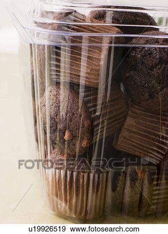 Stock Photo - Double Chocolate Chip Muffins In A Plastic Box. Fotosearch
