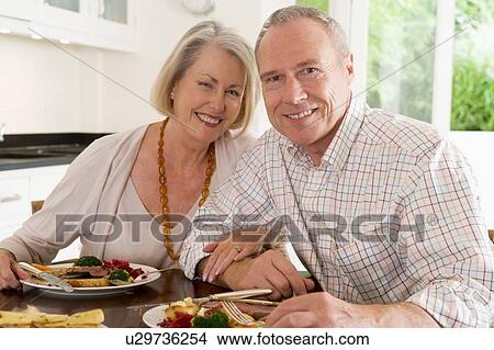 Picture - Elderly Couple Enjoying meal, mealtime Together. Fotosearch