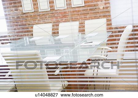 Empty boardroom through a window View Large Photo Image Stock Photo - Empty boardroom through a window. Fotosearch