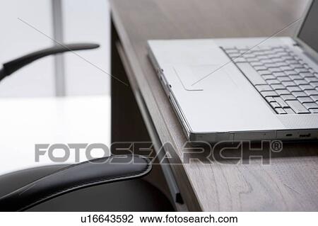 Empty Chair And Desk With Laptop Computer View Large Photo Image Stock Image - Empty Chair And Desk With Laptop Computer. Fotosearch