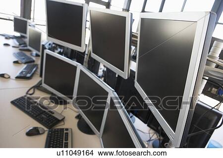 Picture - Empty office space with many monitors. Fotosearch
