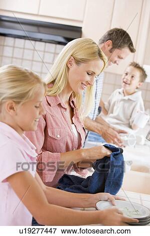 Family Cleaning Dishes Together View Large Photo Image Stock Photo - Family Cleaning Dishes Together . Fotosearch
