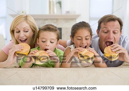 Family Eating Cheeseburgers Together View Large Photo Image Stock Photo - Family Eating Cheeseburgers Together. Fotosearch