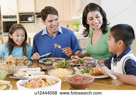 Stock Photo - Family Enjoying meal, mealtime Together. Fotosearch