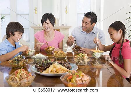 Stock Photo - Family Enjoying meal, mealtime Together. Fotosearch