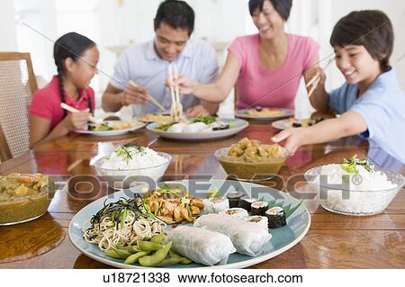 Stock Photo - Family Enjoying meal, mealtime Together. Fotosearch
