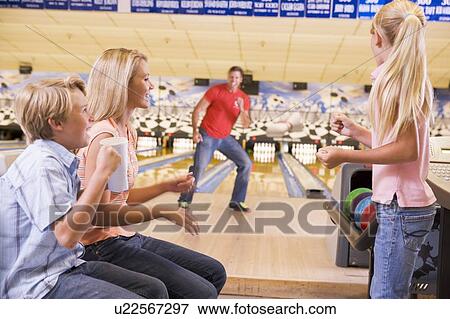 Family in bowling alley smiling View Large Photo Image Stock Photo - Family in bowling alley smiling. Fotosearch