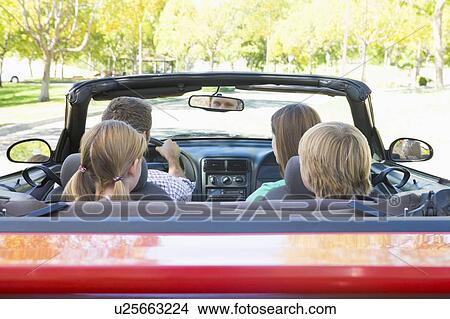Family in convertible car View Large Photo Image Picture - Family in convertible car. Fotosearch