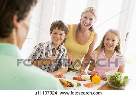 Family Preparing meal, mealtime Together View Large Photo Image Picture - Family Preparing meal, mealtime Together . Fotosearch