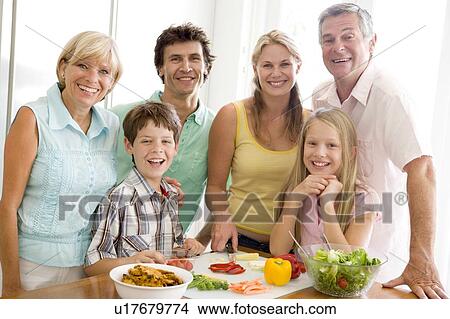 Family Preparing meal, mealtime Together View Large Photo Image Picture - Family Preparing meal, mealtime Together . Fotosearch