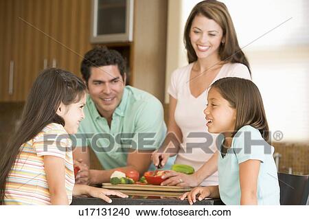 Family Preparing meal, mealtime Together View Large Photo Image Stock Image - Family Preparing meal, mealtime Together . Fotosearch