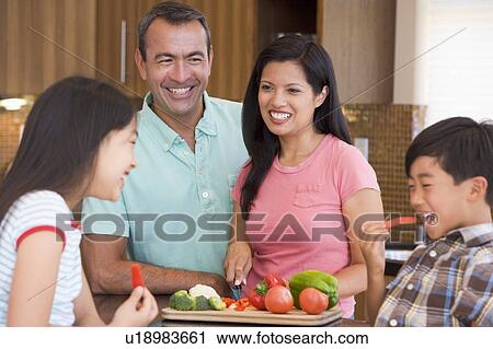 Family Preparing meal, mealtime Together View Large Photo Image Stock Image - Family Preparing meal, mealtime Together . Fotosearch