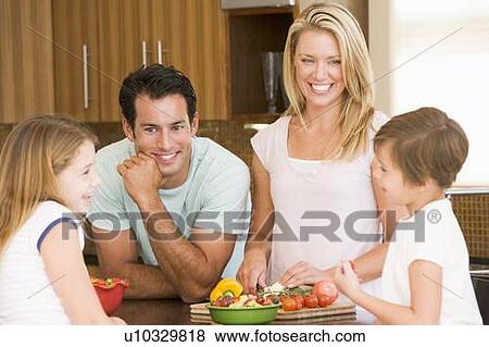 Stock Photo - Family Preparing meal, mealtime Together . Fotosearch