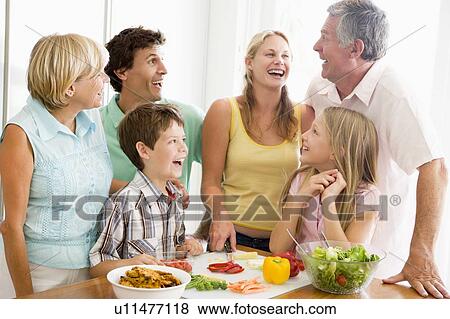Stock Photo - Family Preparing meal, mealtime Together . Fotosearch