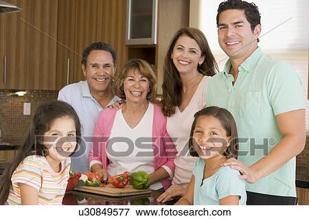 Stock Photo - Family Preparing meal, mealtime Together . Fotosearch