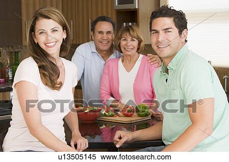 Stock Photography - Family Preparing meal, mealtime Together . Fotosearch