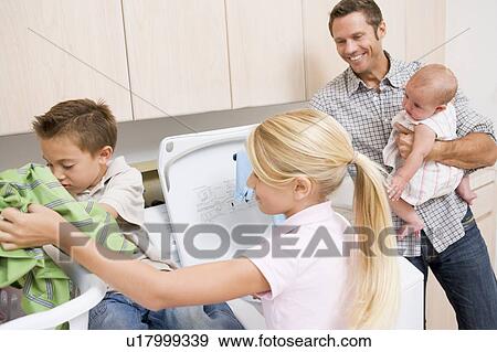 Father And Children Doing Laundry View Large Photo Image Stock Photo - Father And Children Doing Laundry . Fotosearch