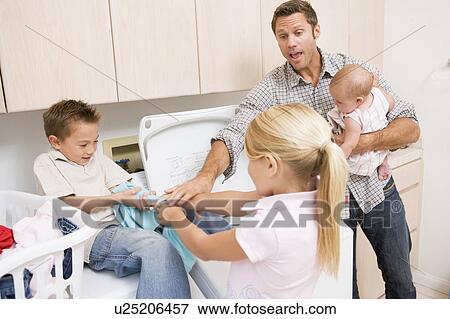 Father And Children Doing Laundry View Large Photo Image Stock Photo - Father And Children Doing Laundry . Fotosearch