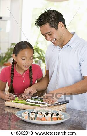 Father And Daughter Preparing Sushi Together View Large Photo Image Stock Image - Father And Daughter Preparing Sushi Together . Fotosearch