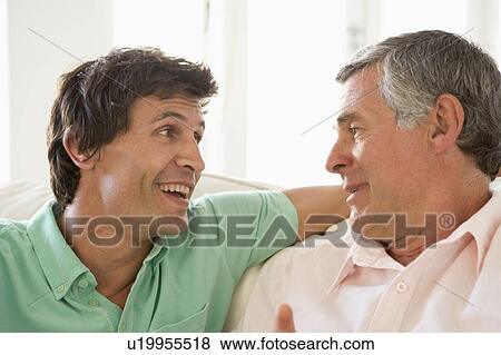 Father and grown up son talking View Large Photo Image Stock Photo - Father and grown up son talking. Fotosearch