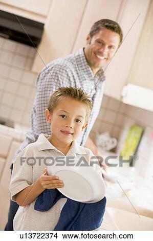 Father And Son Cleaning Dishes View Large Photo Image Picture - Father And Son Cleaning Dishes. Fotosearch