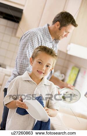 Father And Son Cleaning Dishes View Large Photo Image Stock Image - Father And Son Cleaning Dishes. Fotosearch