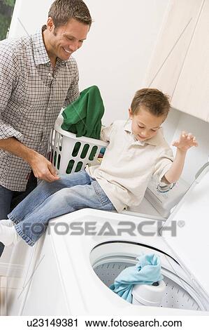 Father And Son Doing Laundry View Large Photo Image Stock Image - Father And Son Doing Laundry . Fotosearch