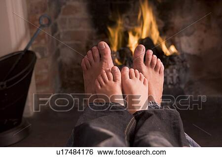 Father and son's Feet warming at a fireplace View Large Photo Image Stock Photograph - Father and son's Feet warming at a fireplace. Fotosearch