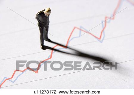 Figurine Of A Businessman Standing On A Line Graph View Large Photo Image Stock Image - Figurine Of A Businessman Standing On A Line Graph. Fotosearch