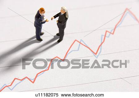Figurines Of Two Businessmen Shaking Hands On A Line Graph View Large Photo Image Stock Photography - Figurines Of Two Businessmen Shaking Hands On A Line Graph. Fotosearch