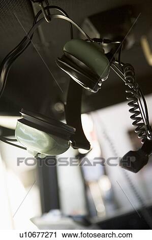 Firefighter's headset hanging in fire engine (selective focus) View Large Photo Image Stock Image - Firefighter's headset hanging in fire engine (selective focus). Fotosearch