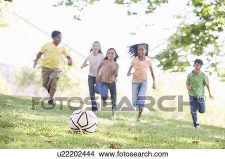 Five young friends playing soccer View Large Photo Image Picture - Five young friends playing soccer. Fotosearch