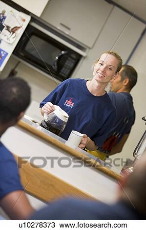 Four firefighters in break room with one getting coffee (selective focus) View Large Photo Image Stock Image - Four firefighters in break room with one getting coffee (selective focus). Fotosearch