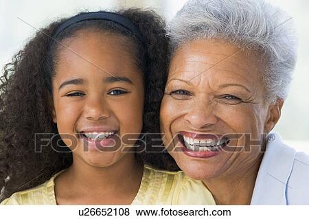 Grandmother and granddaughter smiling View Large Photo Image Stock Photo - Grandmother and granddaughter smiling. Fotosearch