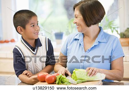Grandmother And Grandson Preparing meal, mealtime Together View Large Photo Image Stock Image - Grandmother And Grandson Preparing meal, mealtime Together. Fotosearch