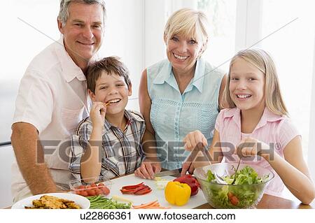 Grandparents And Grandchildren Prepare A meal, mealtime Together View Large Photo Image Stock Image - Grandparents And Grandchildren Prepare A meal, mealtime Together . Fotosearch