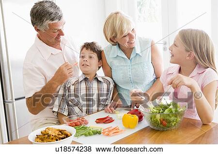 Grandparents And Grandchildren Prepare A meal, mealtime Together View Large Photo Image Stock Photo - Grandparents And Grandchildren Prepare A meal, mealtime Together . Fotosearch
