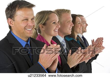 Group Of Business People In A Line Smiling And Applauding View Large Photo Image Picture - Group Of Business People In A Line Smiling And Applauding. Fotosearch