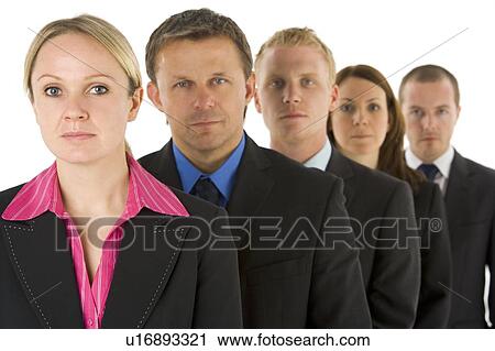 Stock Image - Group Of Business People In A Line Looking Serious . Fotosearch