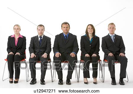 Stock Image - Group Of Business People Sitting In A Line . Fotosearch