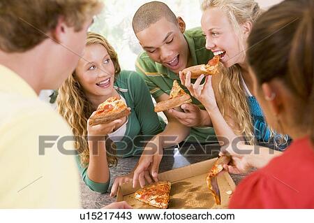 Group Of Teenagers Eating Pizza View Large Photo Image Stock Image - Group Of Teenagers Eating Pizza . Fotosearch