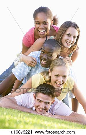 Group Of Teenagers Having Fun Outdoors View Large Photo Image Stock Image - Group Of Teenagers Having Fun Outdoors . Fotosearch