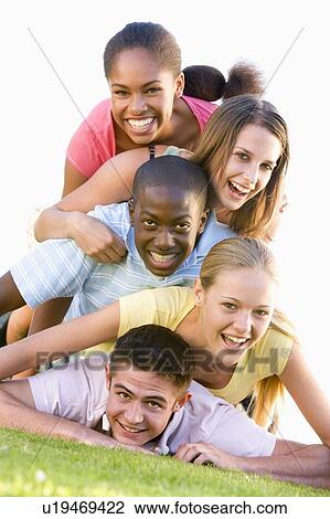 Group Of Teenagers Having Fun Outdoors View Large Photo Image Stock Image - Group Of Teenagers Having Fun Outdoors . Fotosearch