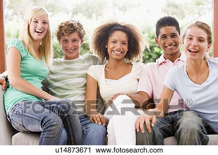 Group Of Teenagers Sitting On A Couch View Large Photo Image Stock Image - Group Of Teenagers Sitting On A Couch. Fotosearch