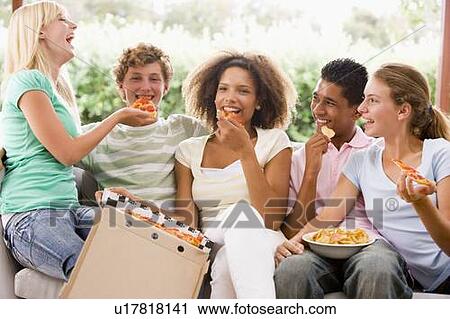 Group Of Teenagers Sitting On A Couch Eating Pizza View Large Photo Image Stock Image - Group Of Teenagers Sitting On A Couch Eating Pizza. Fotosearch